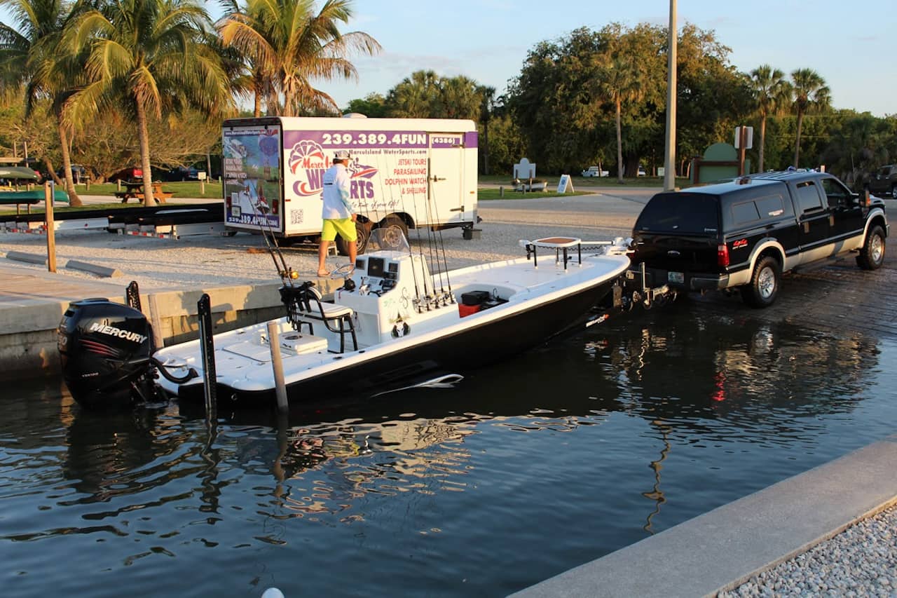 Where you’ll want to stop will vary by different boat ramps, different rigs, and tide level. That said, you want most but not all of the boat floating.