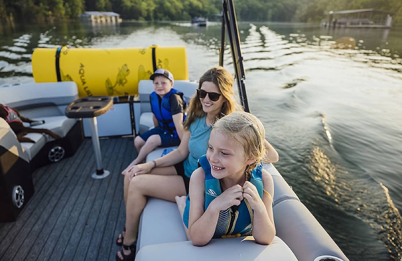 Family-on-pontoon-lowe - Whether you’re looking for a boat to take out on the lake, a small boat you can trailer, or a fishing boat, the perfect boat is out there somewhere for you and your family.