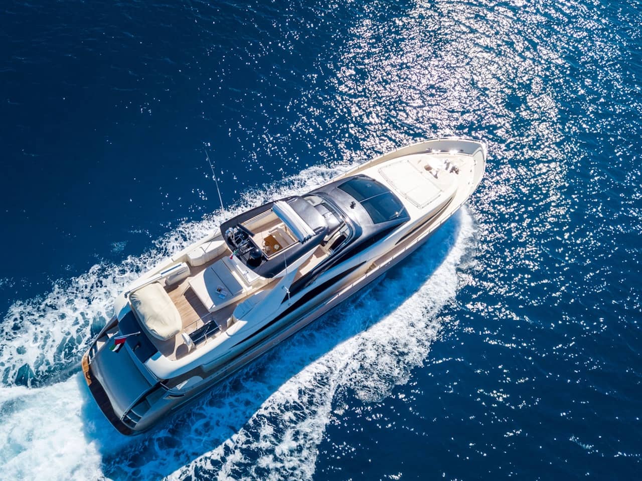 Aerial shot of a yacht sailing at sea