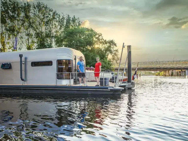 The Coon 1000 Houseboat