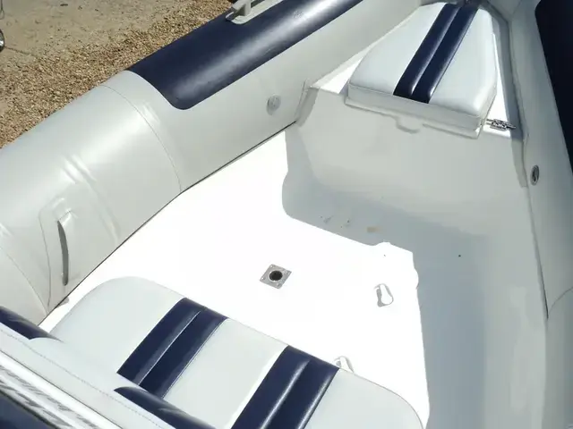 Ballistic Used  5.5m RIB with Evinrude 90Hp Outboard and Trailer