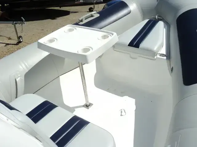 Ballistic Used  5.5m RIB with Evinrude 90Hp Outboard and Trailer